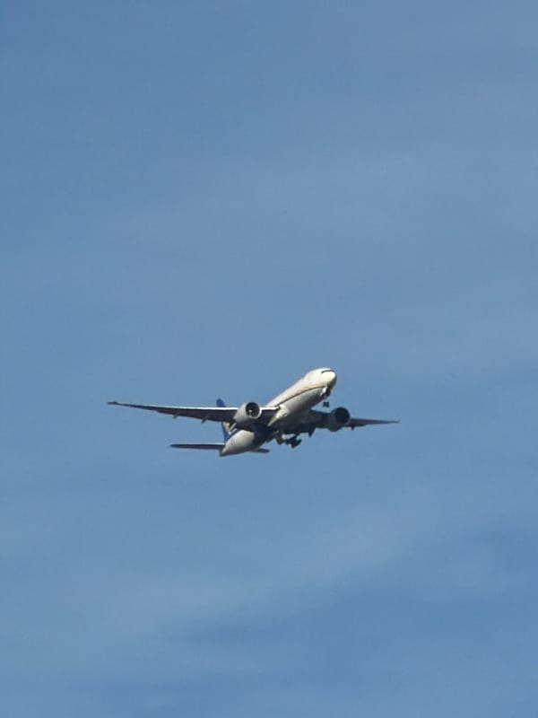 Dawn sunset captured over Leudelange buildings with contrails visible