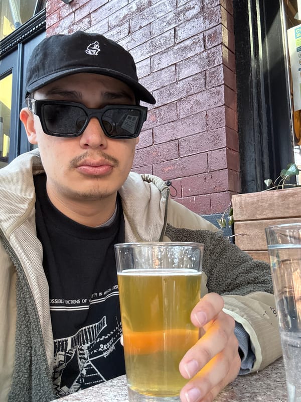 Person enjoys beer outdoors in New York City