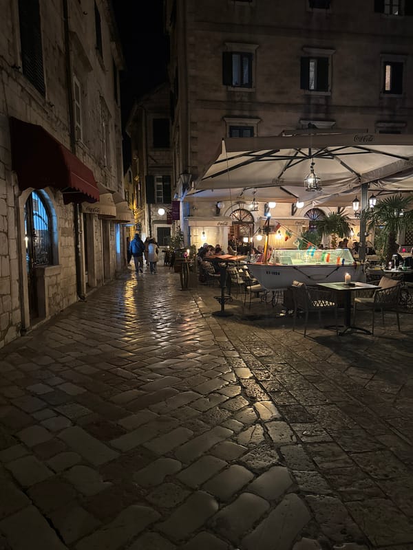 Evening cafe life documented in Kotor's old town
