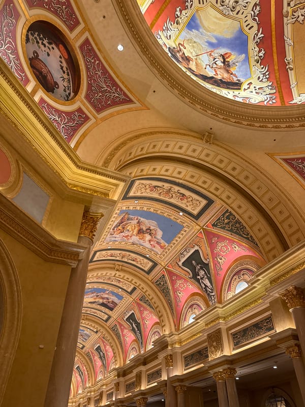 Tourist documents ornate Macao interiors, enjoys Starbucks coffee