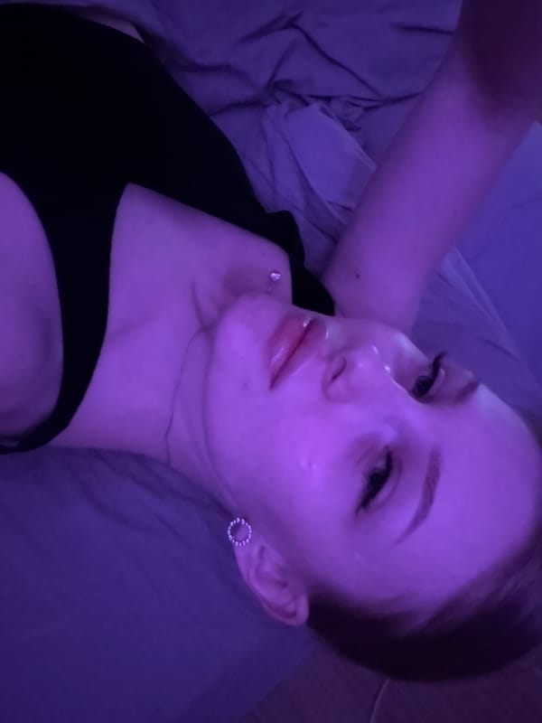 Woman photographed resting indoors in Perm under colored lighting