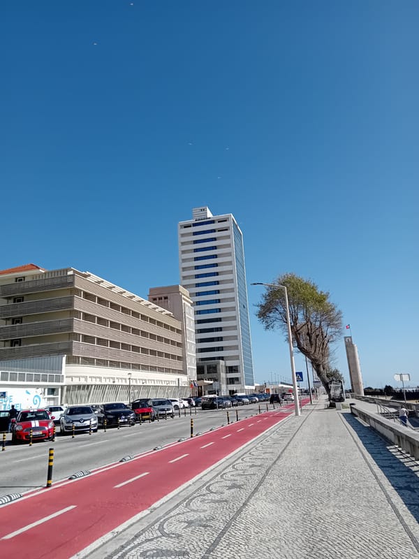 Urban coastal walk documented through modern buildings and gardens