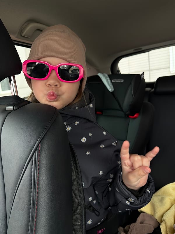 Children play with pigeons in Chaikovsky public square