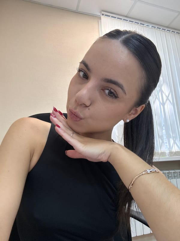 Casual selfie, black top and rose gold bracelet.
