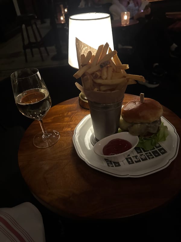 Late-night burger meal documented at New York table