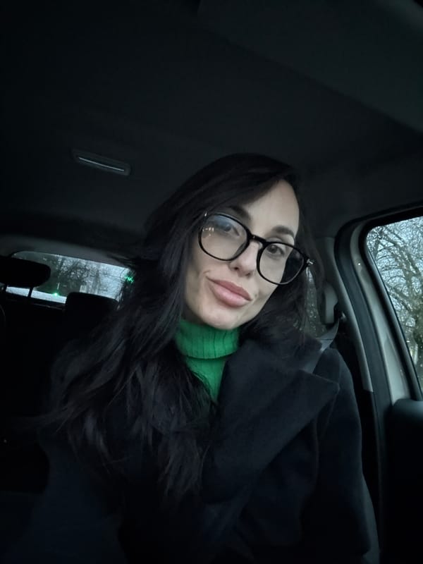 Woman in green sweater observed in car in Pleven