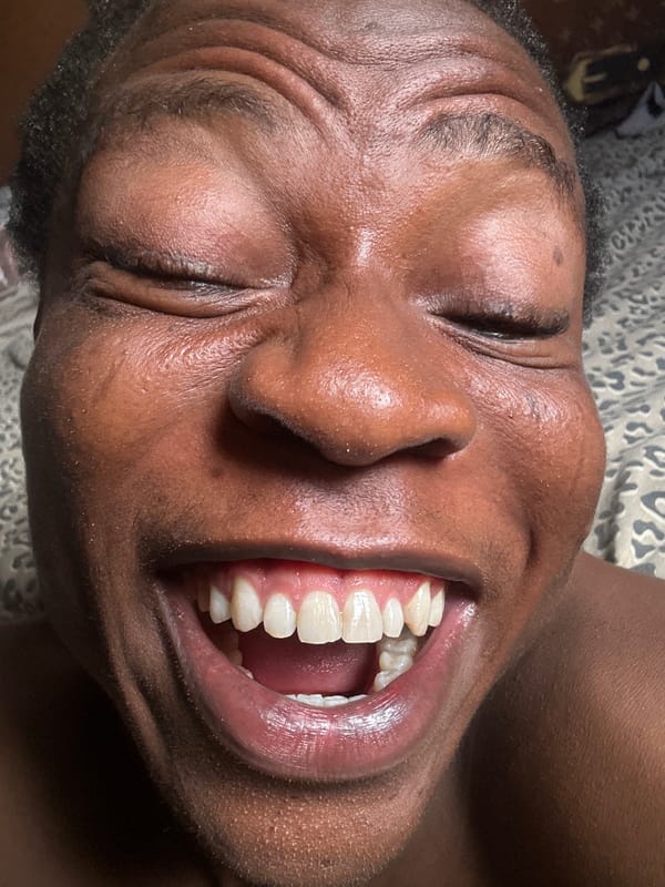 Person captured making animated expressions during private bedroom session