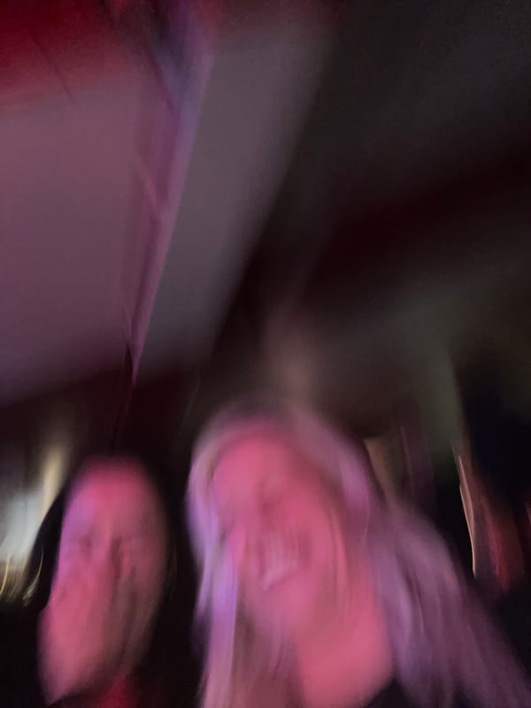 Women take playful selfie video in London bar