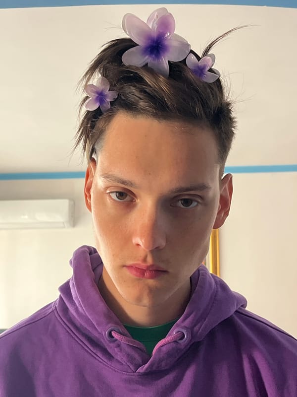 Young person spotted wearing purple hoodie, flowers in Budva