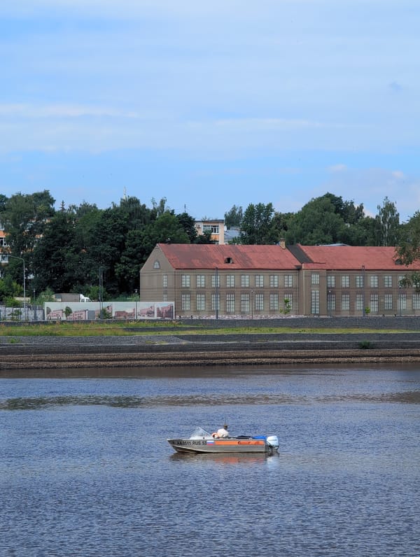 Summer morning activity along Veliky Novgorod's Volkhov River embankment