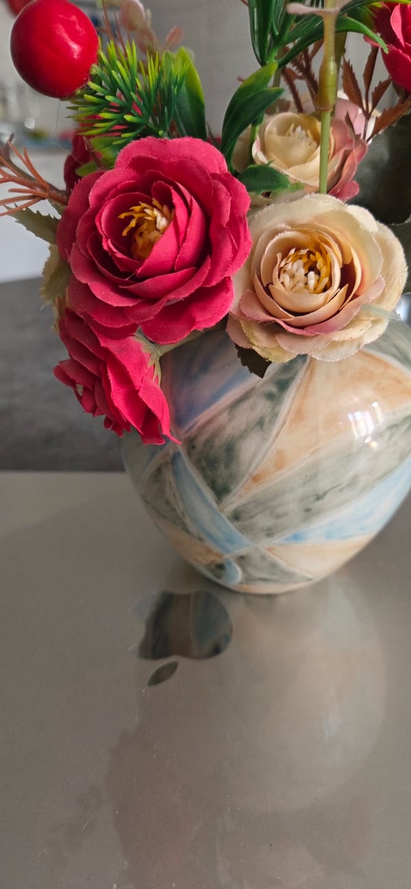 Artificial floral arrangement with ceramic object documented