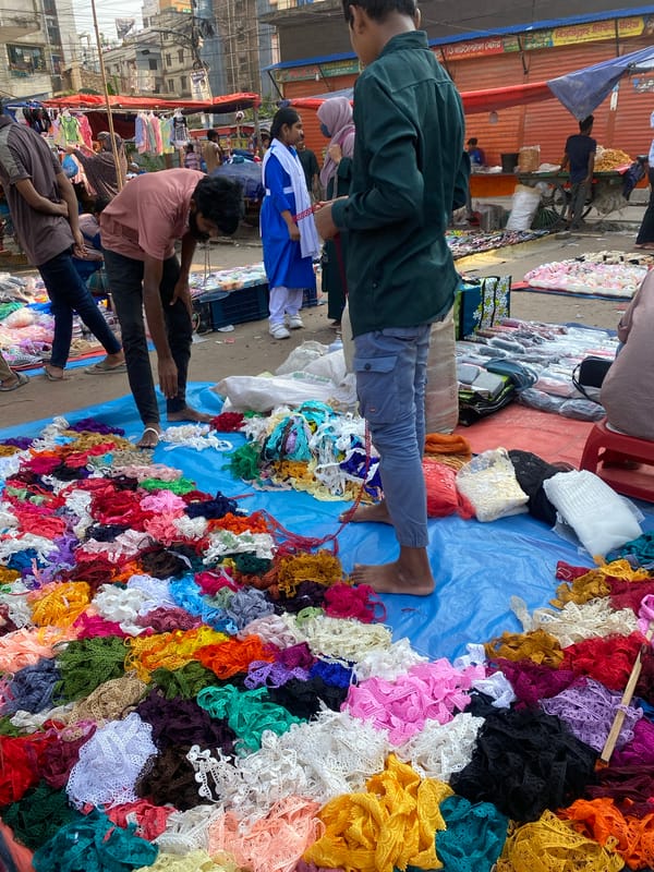 Street market bustling with vendors in Dhaka Bangladesh