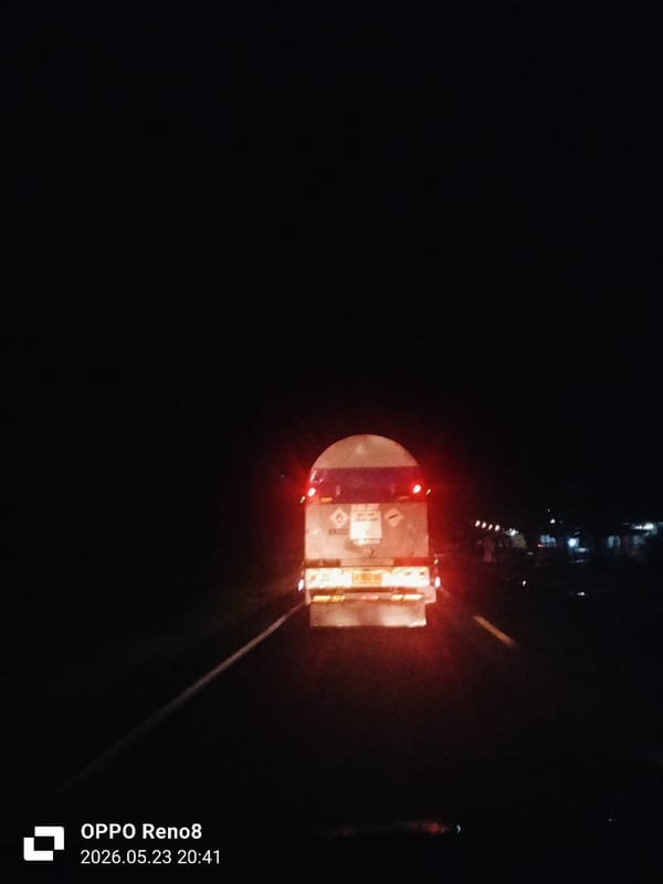 Tanker truck travels nighttime road in Pandrahkandeh, Indonesia