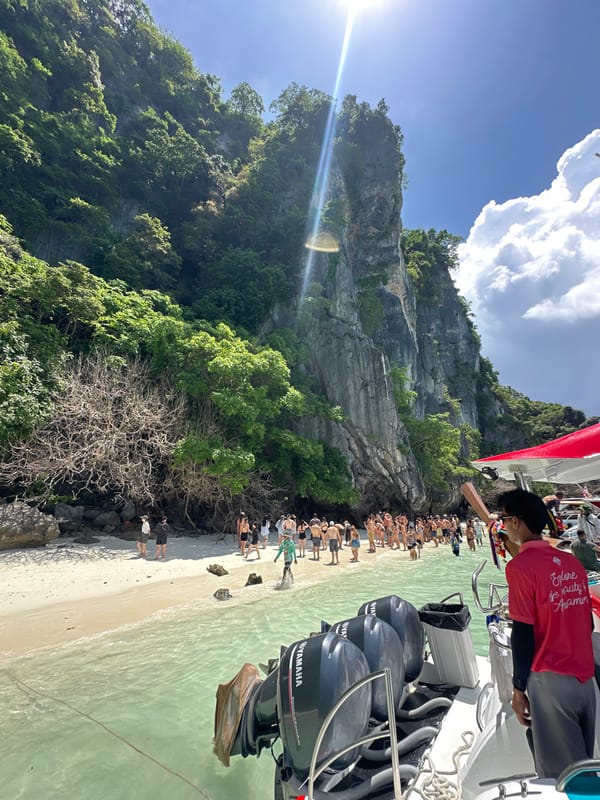 Limestone cliffs, turquoise water, and monkeys at Ao Nang