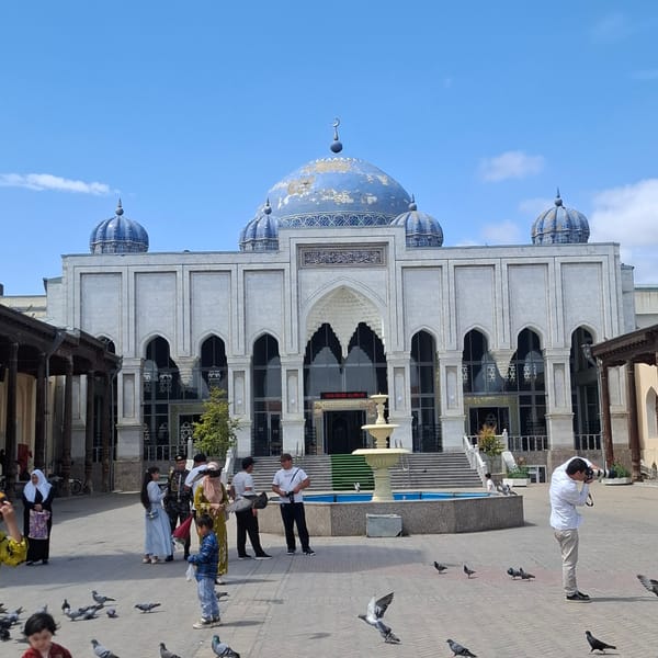 Morning marketplace activity captured around Khujand public square