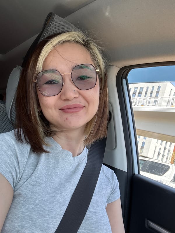 Woman observed sitting in car in urban Astana