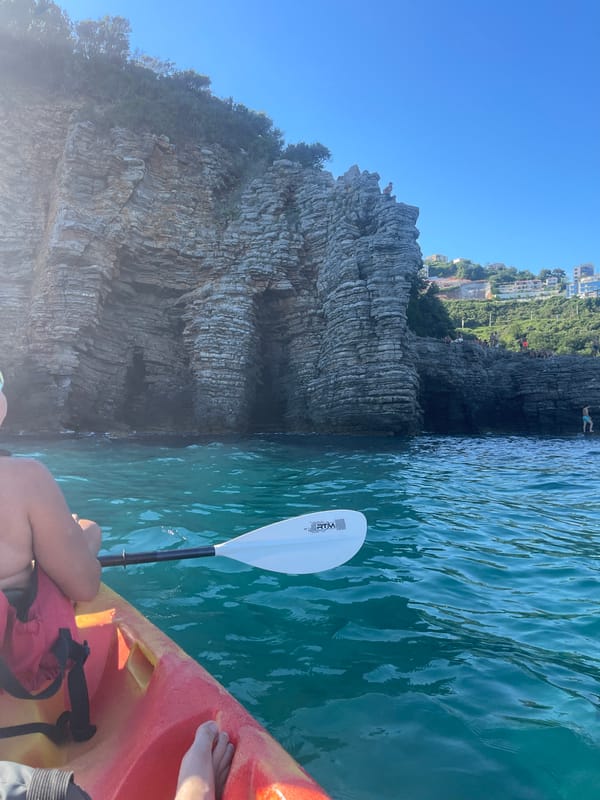 Cliff jumping and kayaking off Budva's rocky coastline
