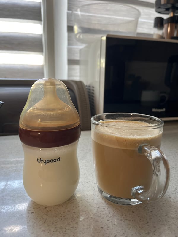 Baby bottle and coffee mug on a countertop in Nizhny Novgorod