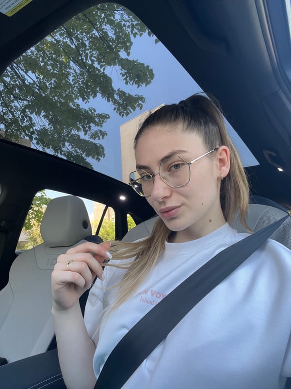 Woman photographed driving car with sunroof, May 6