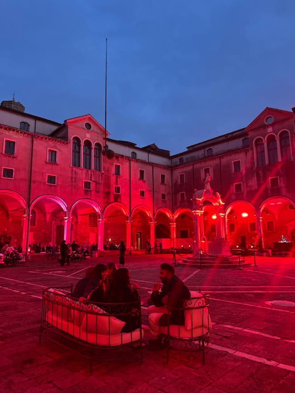 Red-lit building draws crowds to outdoor seating in Venice