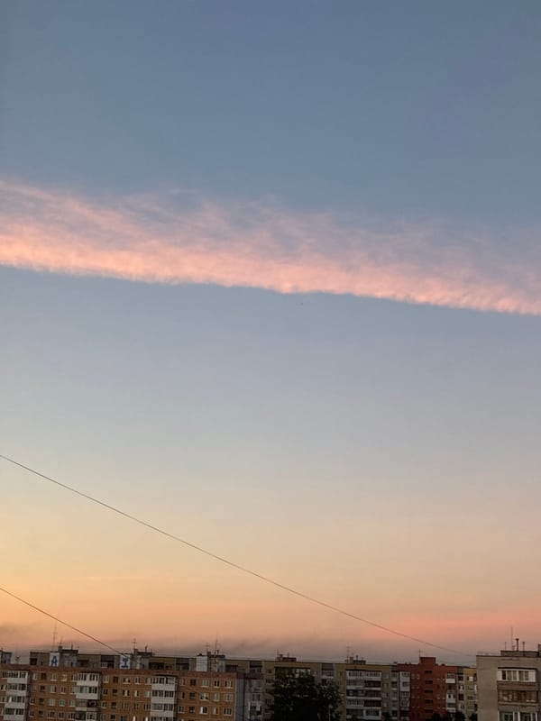 Sunset cityscape with distinctive streaking clouds documented across 16 minutes