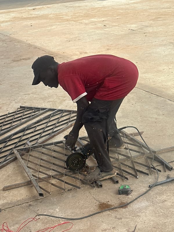 Angle grinder work on metal grating, Barakin Lerawi, Nigeria