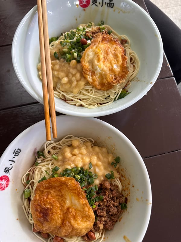 Noodle bowls with fried eggs served in Yuzhong District