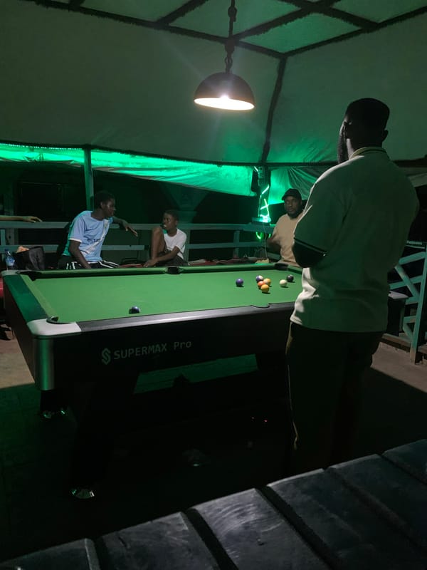Outdoor billiards under neon lights in Lokoja at night