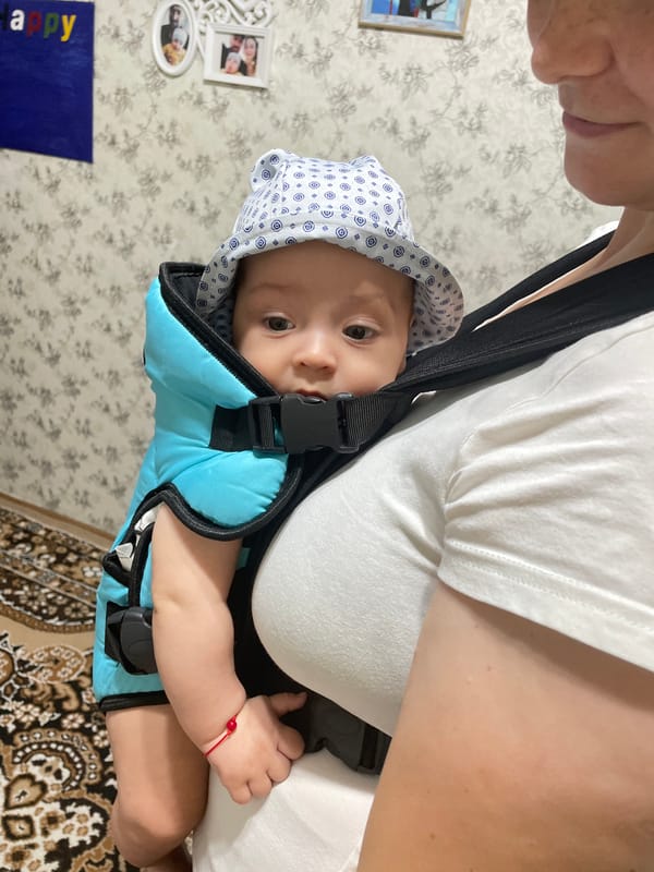 Curious baby in a bucket hat, out in Fălești