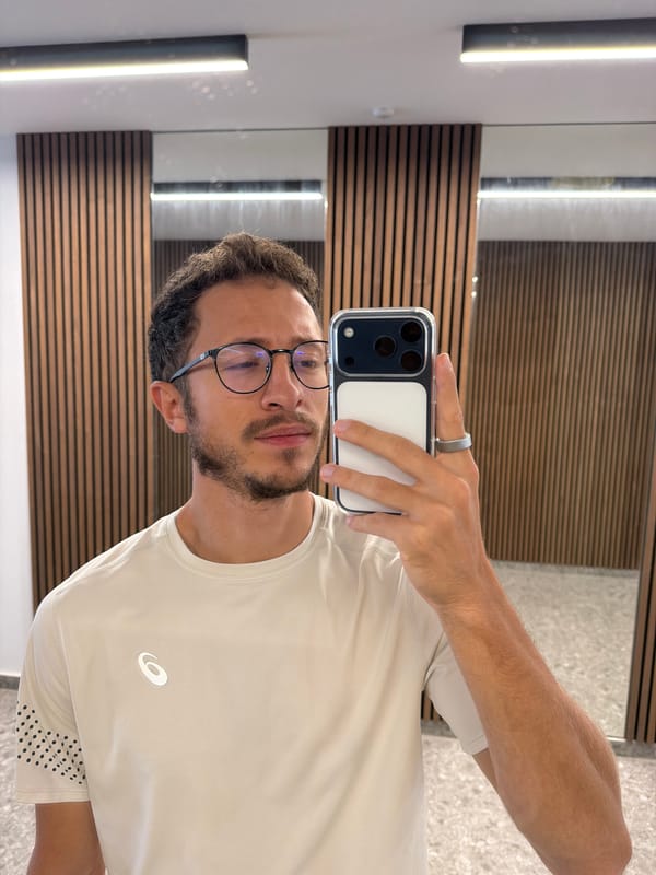 Man takes selfie in wooden-paneled interior space in Cyprus