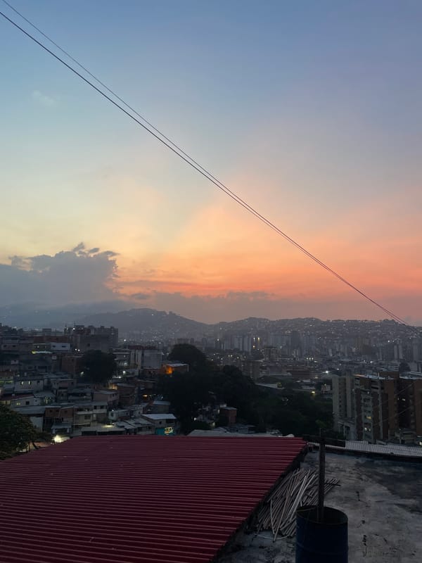 Sunset illuminates Caracas cityscape in warm evening colors