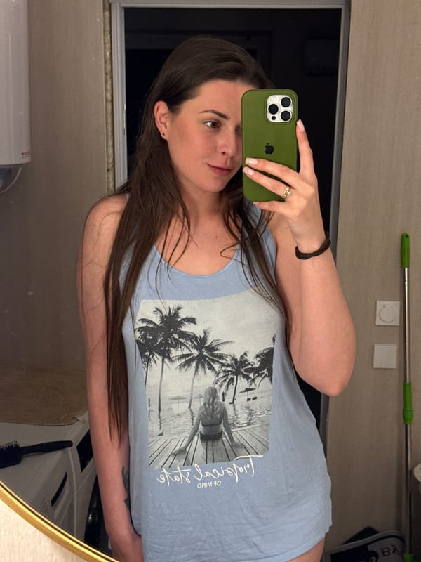 Woman conducts extended selfie session with cats, strawberry