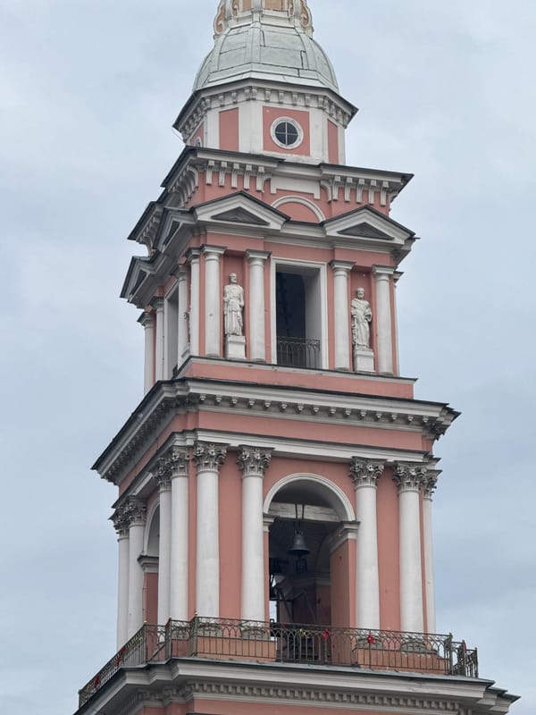 Smolny Cathedral's pink bell tower on a cloudy Saint Petersburg day