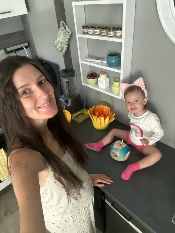 Mother and child enjoy morning coconut drinks in Wisła