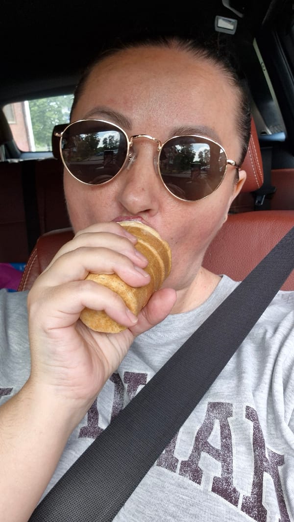 Enjoying conical pastry in Kemerovo selfie