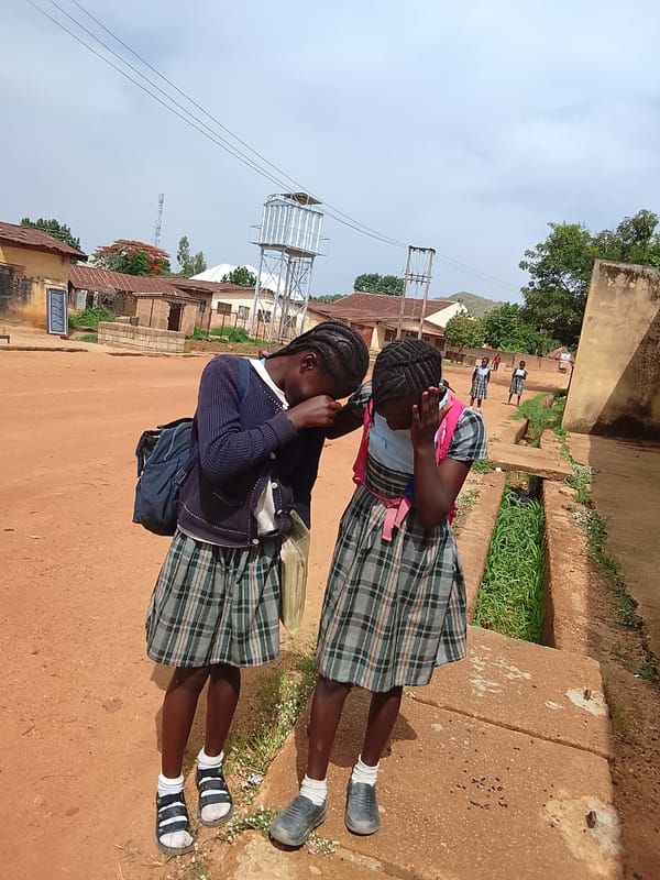 Children photographed in playful moments at same location