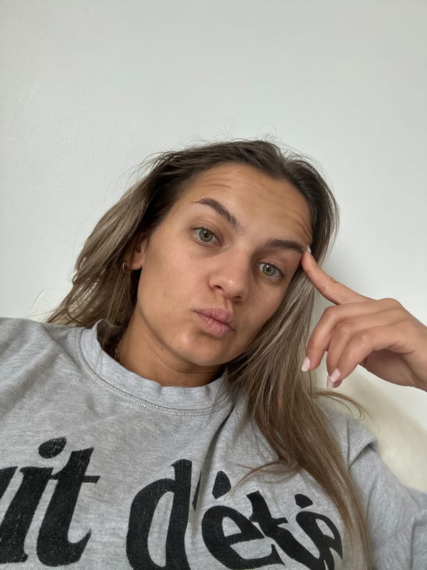 Woman takes morning selfie in French home interior