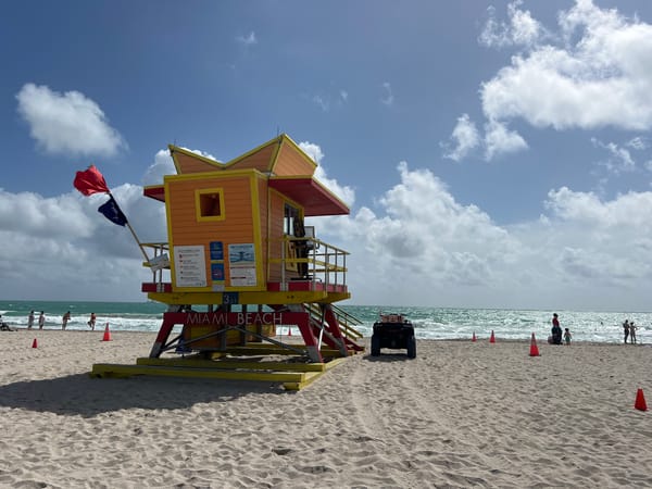 Miami Beach afternoon scenes include lifeguard station, park walkers