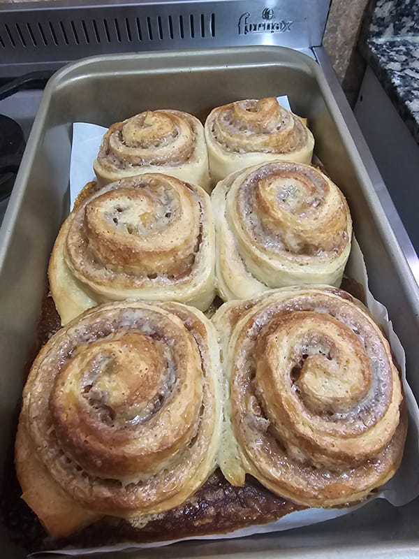 Freshly baked cinnamon rolls documented in Buenos Aires kitchen