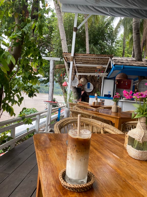 Iced coffee and Mekong River views at a Luang Prabang cafe