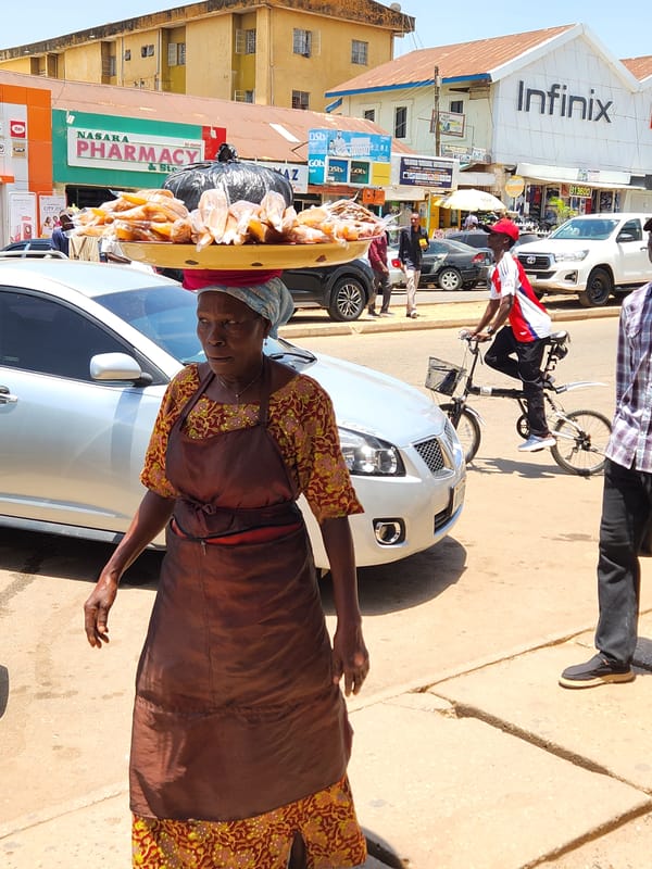 Street vendors conduct daily business in urban marketplace