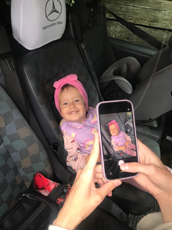 Baby photographed on car seat in Wisła, Poland