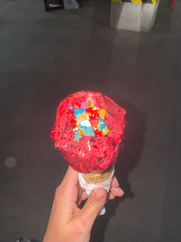 Woman enjoys red ice cream, visits exercise studio