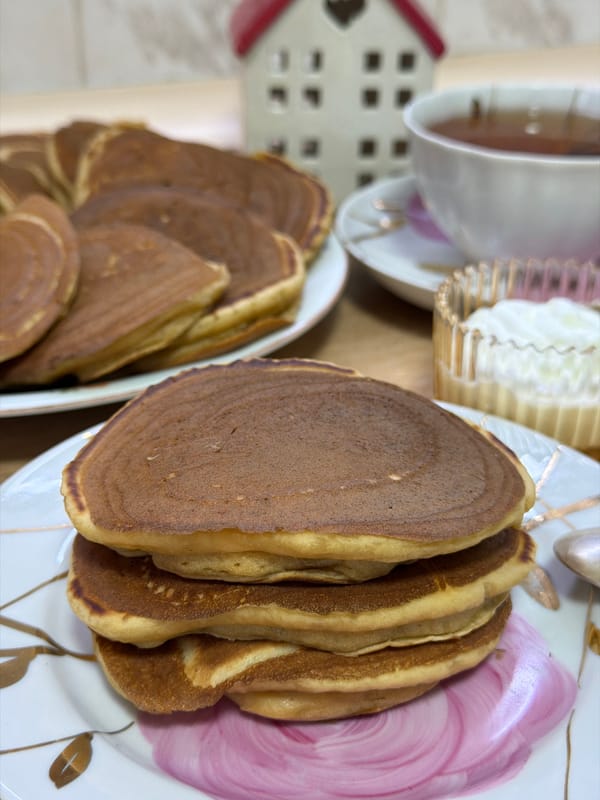 Quiet evening with pancakes, sleeping cat, and TV in Izhevsk
