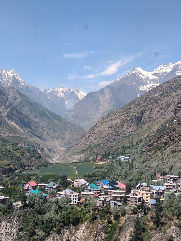 Keylong village nestled in a Himalayan valley below snowy peaks