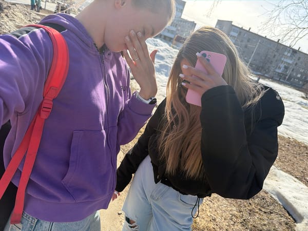 Two women take selfies, document street scenes in Berezniki