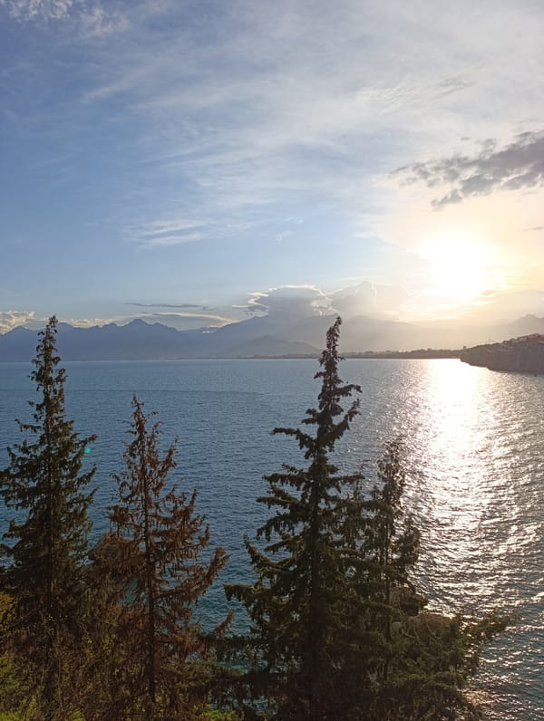Tourist documents scenic Antalya coastline and city views