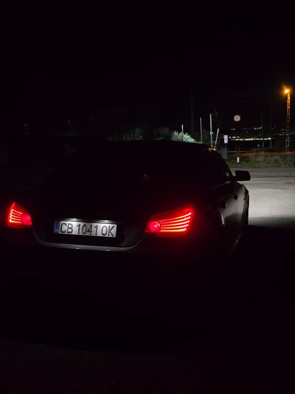 Car with brake lights observed in nighttime Sofia street