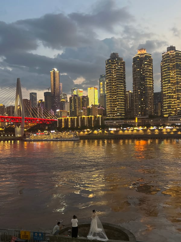 Chongqing skyline and river bridges at dusk and night