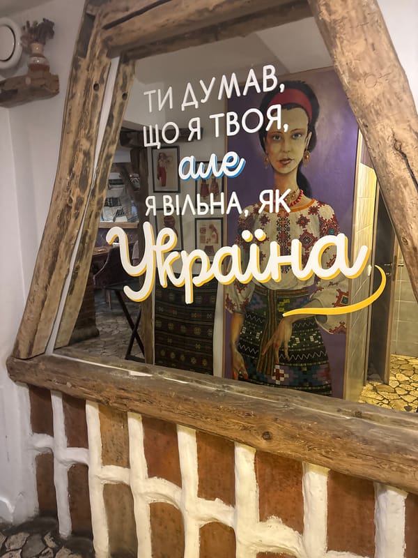 Inside a Ukrainian folk restaurant, with countryside roads in between.